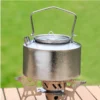 1L pure titanium kettle pouring tea into small cups on an outdoor table.