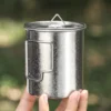 Close-up of crystalline natural titanium camp mug with folding handle