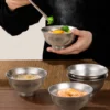 TiRoam pure titanium bowl holding a hot rice meal with steam, durable lightweight titanium bowl for warm food, home dining, camping, and outdoor meals.