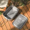 TiRoam titanium lunch box with titanium utensils inside and lid beside it, compact outdoor meal kit for camping, backpacking, picnics, and travel.