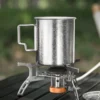 Pure titanium camp mug with crystalline finish on a camping stove