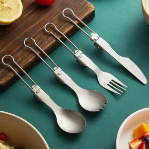 Foldable pure titanium camping cutlery set on tabletop