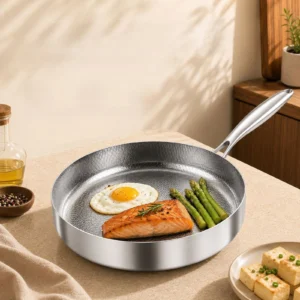Titanium frying pan with salmon, fried egg, and asparagus