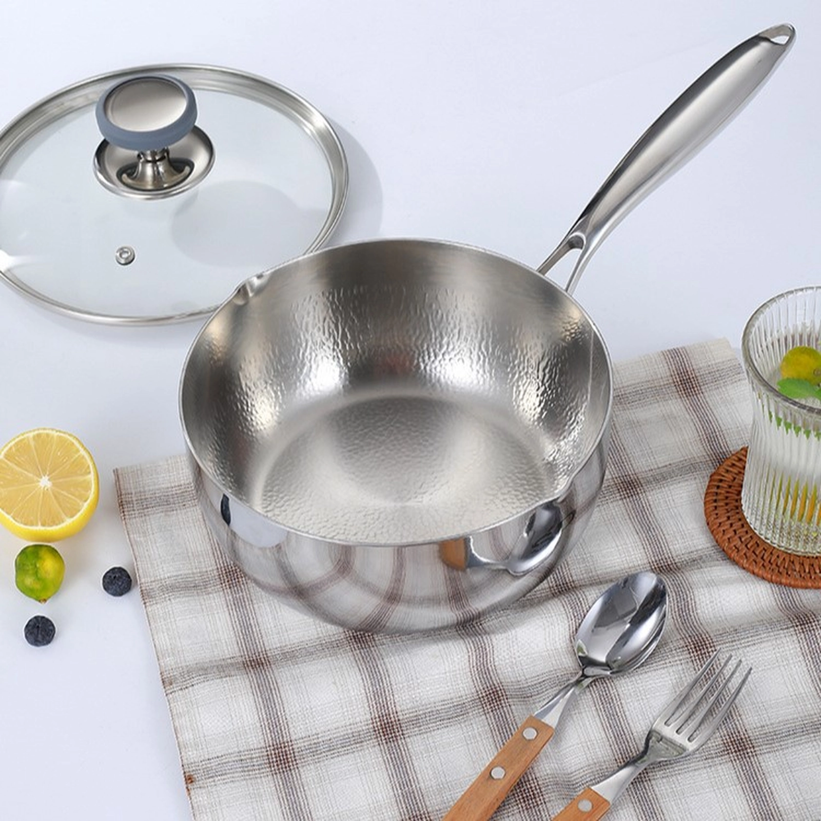 Pure titanium saucepan with hammered interior and pouring spout