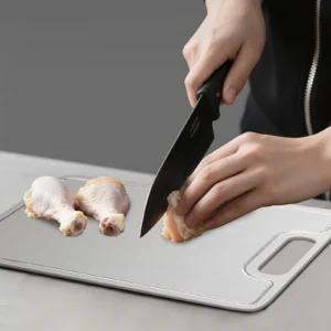 Pure titanium cutting boards used for meat, bread, fruit, and everyday food preparation.