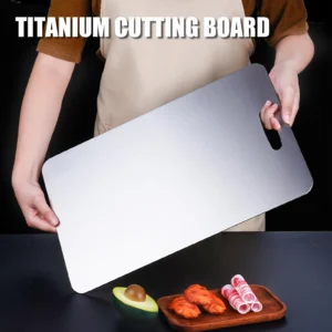 Person holding a large pure titanium cutting board with rounded corners and built-in handle.