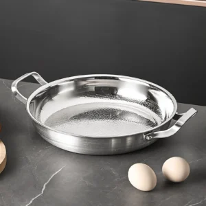 Pure titanium frying pan with hammered cooking surface and dual handles
