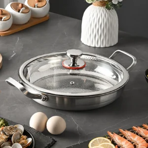 Titanium frying pan with hammered interior and glass lid for everyday cooking