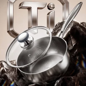 Titanium saucepan with glass lid and polished stainless steel handle