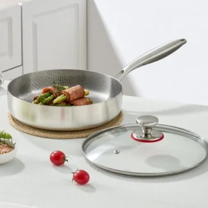 Titanium frying pan shown with removable tempered glass lid