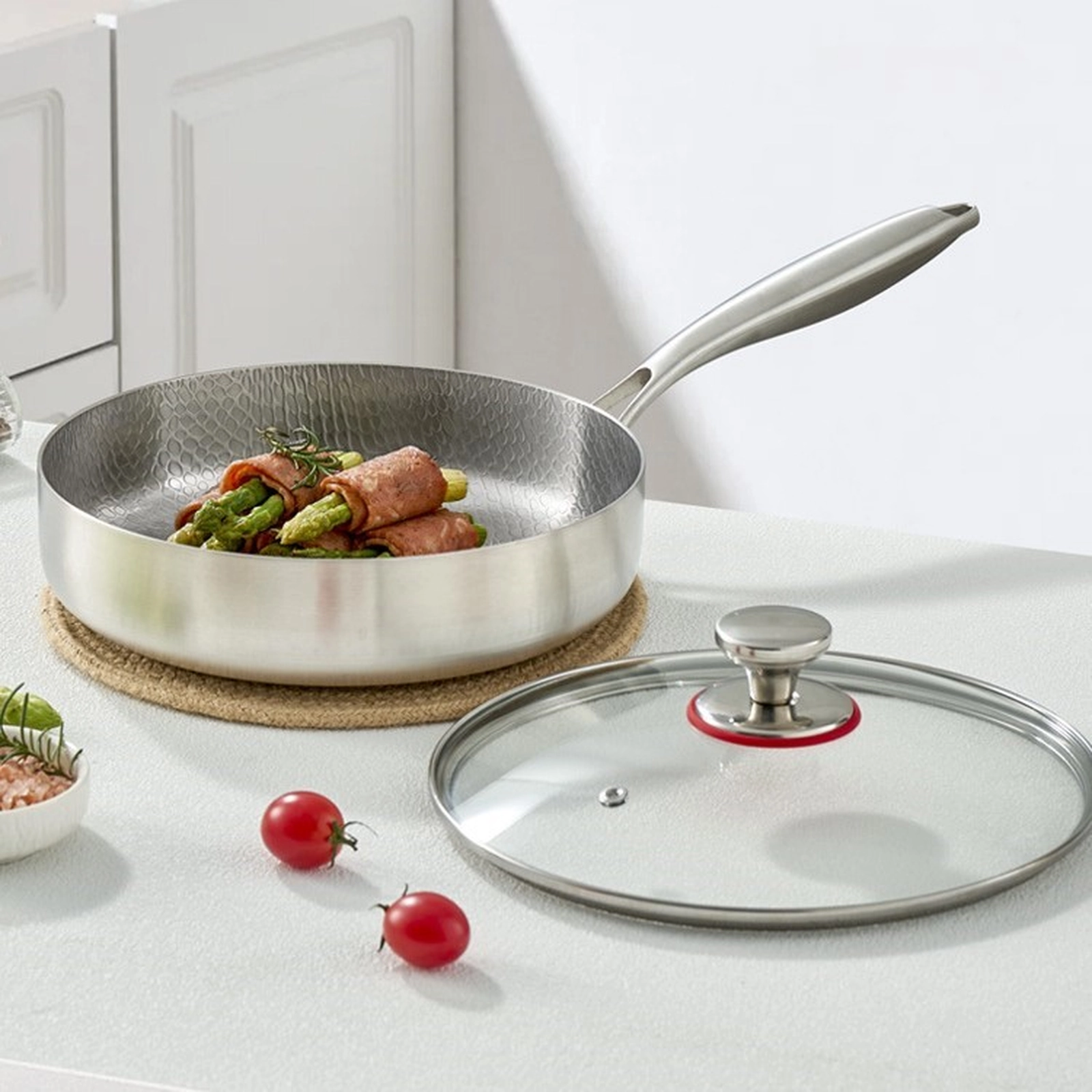 Titanium frying pan shown with removable tempered glass lid