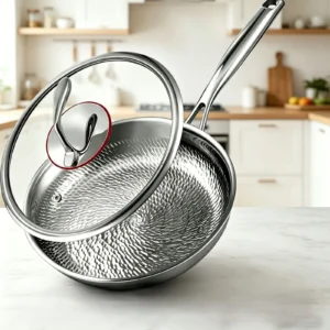 Titanium frying pan with a textured cooking surface and glass lid displayed in a bright home kitchen.